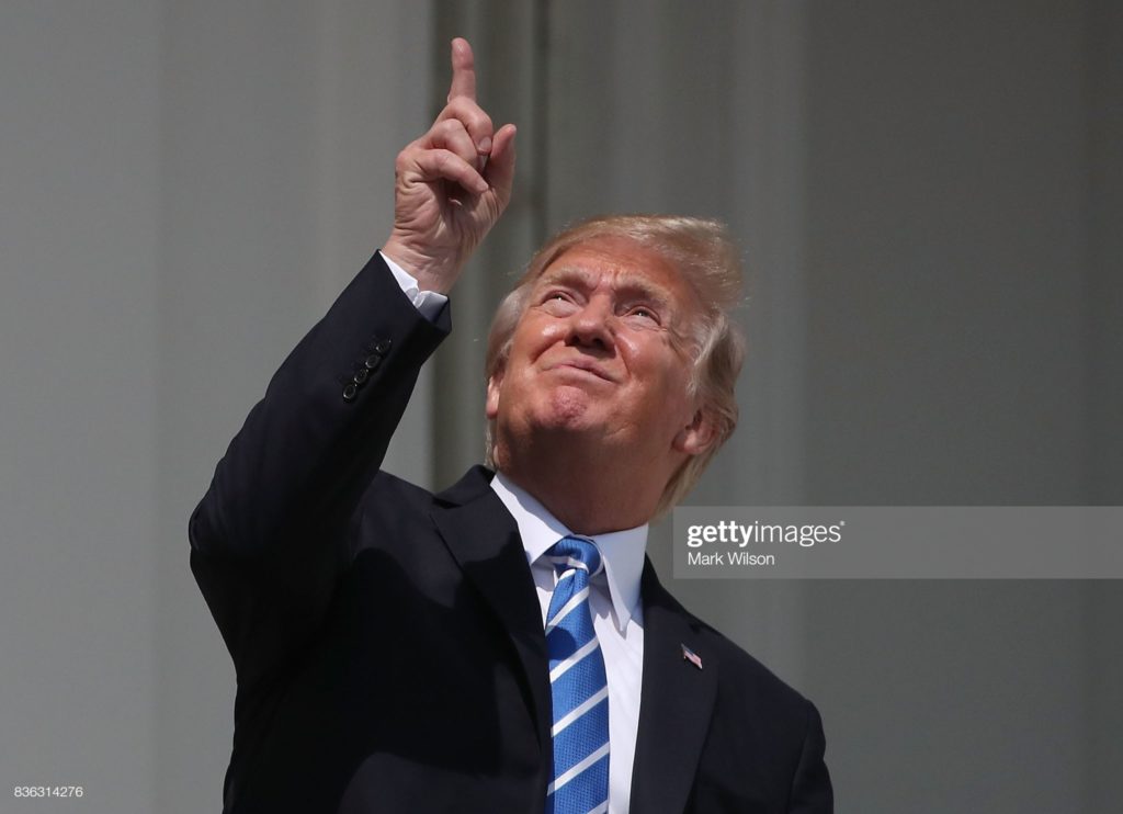 Donald John Trump, of Trump University, looks at a solar eclipse, without eye protection, Truman Balcony, White House, Washington, D.C., Monday, 21 August 2017. (Photographer Mark Wilson / Getty Images News via Getty Images.)