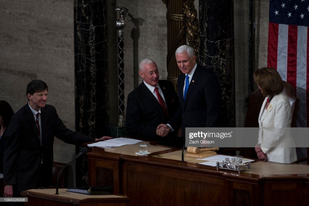 Greg Pence and Mike Pence shake hands, chamber of the U.S. House of Representatives, U.S. Capitol Building, Washington, D.C., Tuesday, 5 February 2019.