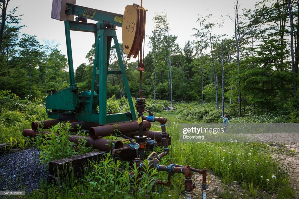 Abandoned oil pumpjack stand, Allegheny National Forest, Pennsylvania, Monday, 6 June 2016. (Photographer Chris Goodney / Bloomberg via Getty Images.)