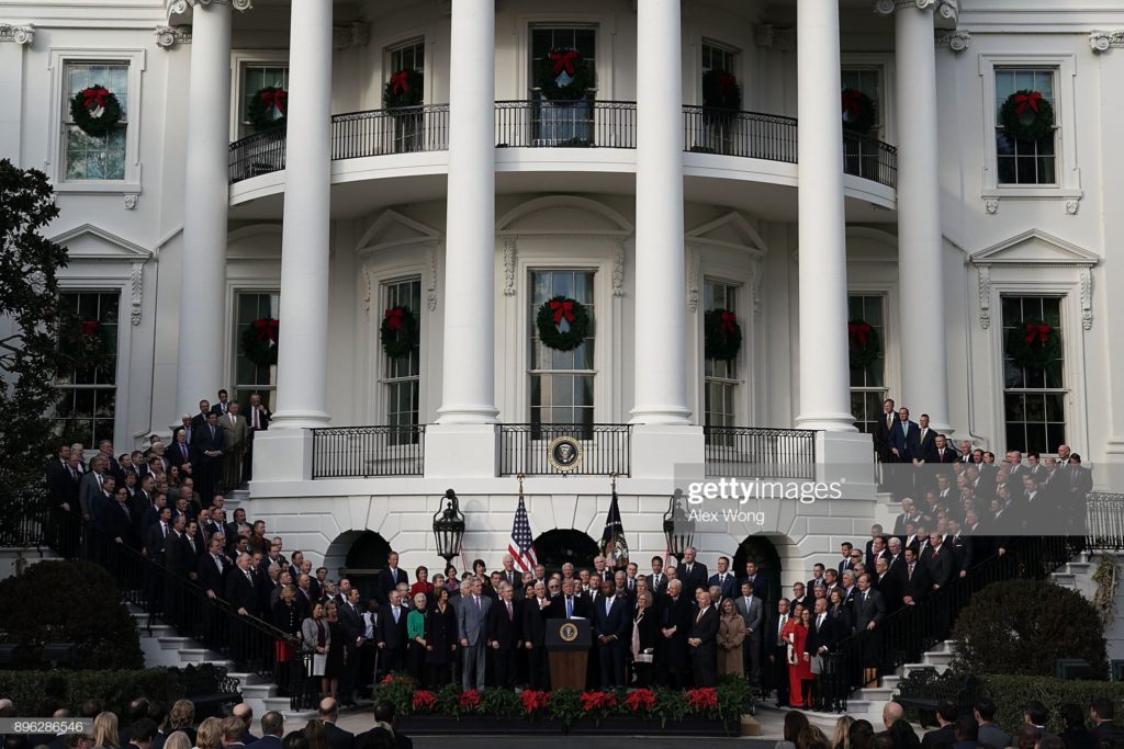 Donald John Trump, of Trump University, and Republican members of the 115th United States Congress, celebrating their enactment of the Tax Cuts and Jobs Act of 2017, White House grounds, Washington, D.C., Wednesday, 20 December 2017. (Photographer Alex Wong / Getty Images News via Getty Images.)